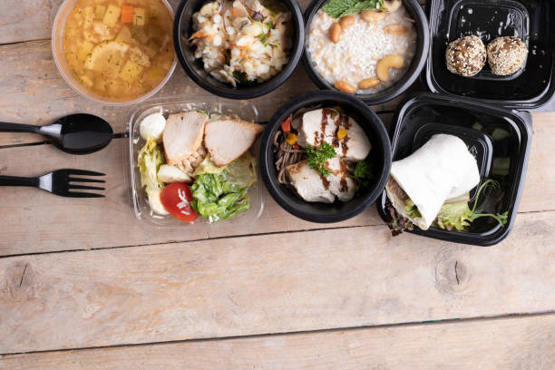 istock Tasty lunch in plastic containers on wooden table close up 1207095702
