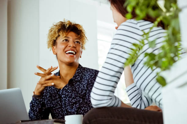 istock Woman visiting cheerful financial expert in office 1207096685