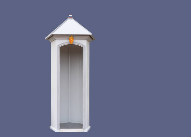 Empty white sentry box with royal insignia on an isolated blue background. Template.Sentry-box - a structure providing shelter for a standing watchman.