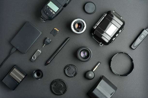 istock Flat assembly composition with photo production equipment on plain black background 1207097106