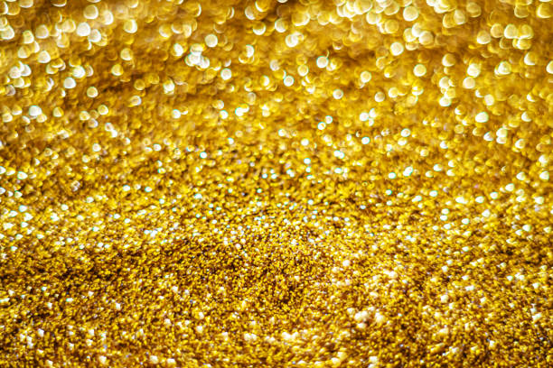 istock Glitter light abstract gold bokeh blurred background 1207097426