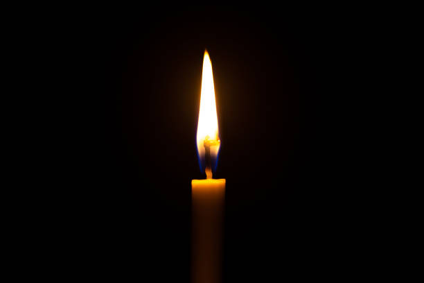 istock Candle light on black background ,Black background candle 1207097500