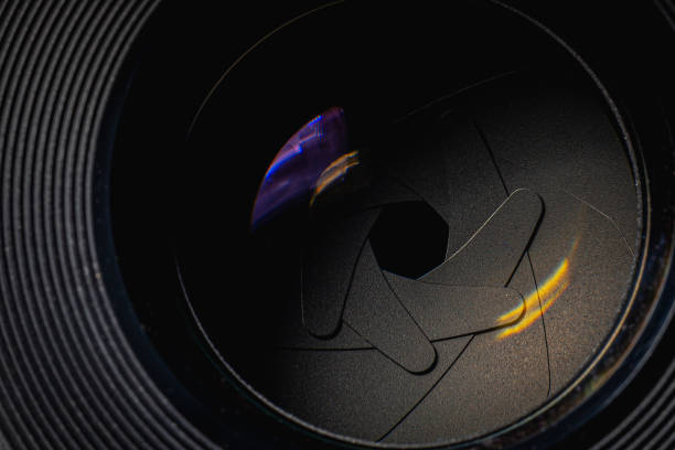 istock Closeup of photo camera lens background 1207098604