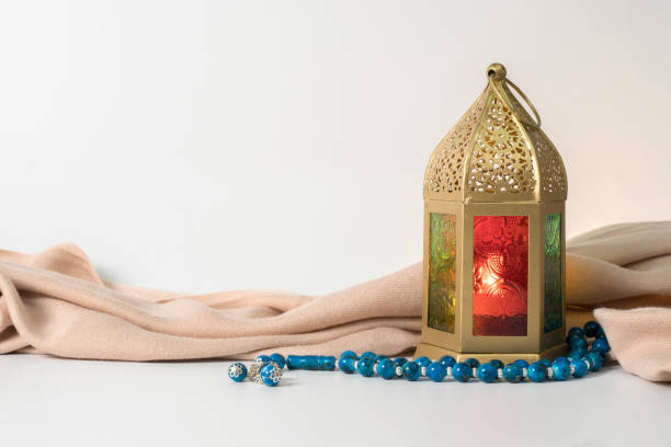 istock Ramadan Lantern and Blue rosary beads, surrounded with cloth. 1207099749