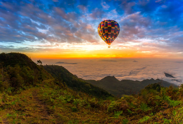 istock Hot air balloon flying over Phu Tab Berk hill in morning 1207101319