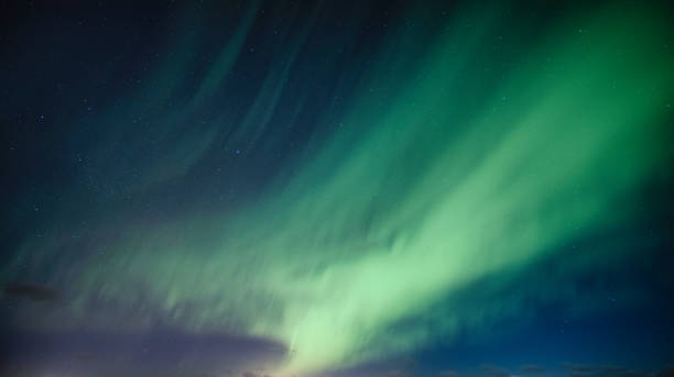 istock Aurora Borealis, Northern Lights with star on arctic circle 1207101565