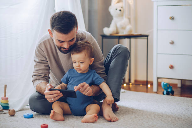 istock Watching cartoons together 1207101969