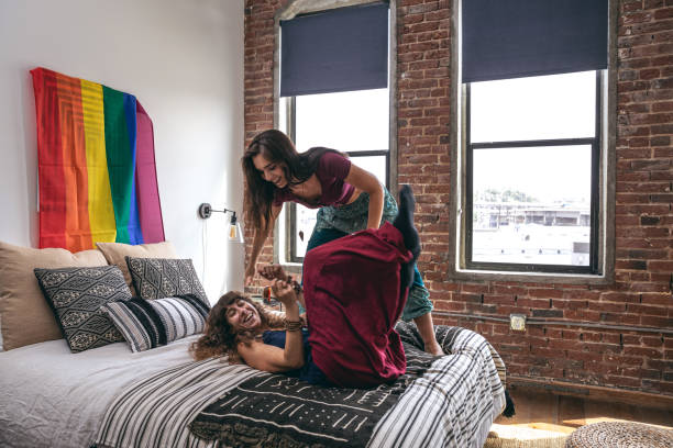 istock Beautiful women couple at home 1207103270