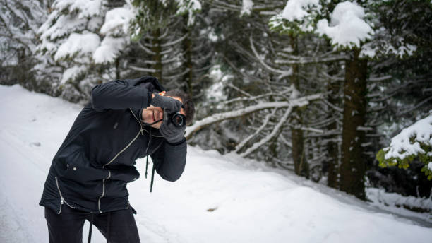 istock Man taking picture on a winter day 1207103388