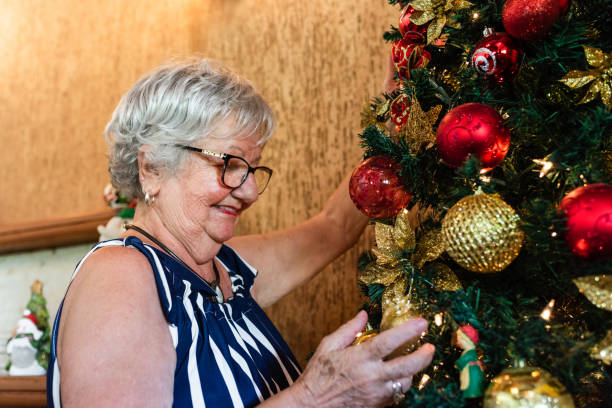 istock Grandma decorating the Christmas tree 1207106366