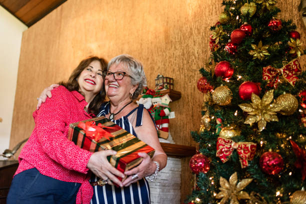 istock Hug and Christmas gifts 1207106373