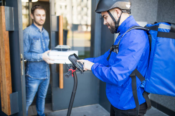 istock Man delivering food 1207106435