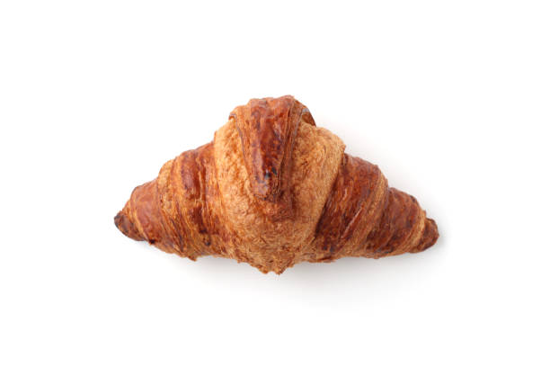 istock croissant french bread closeup isolated on white background 1207107855