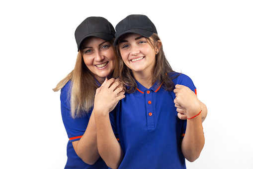 Portrait of two happy women, mother and daughter in blue T-shirts