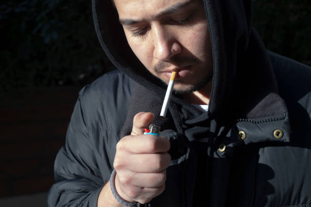 istock Young photographer smokes a cigarette on his break 1207109310