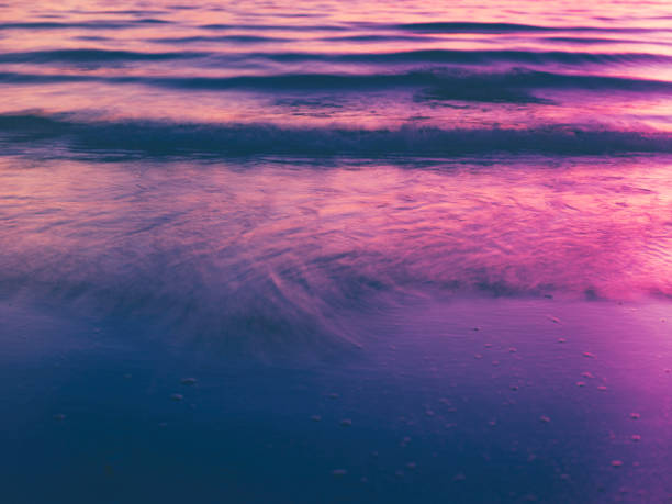 istock Blurred Pink and Purple Waves in Motion Closeup Backgrounds 1207109702