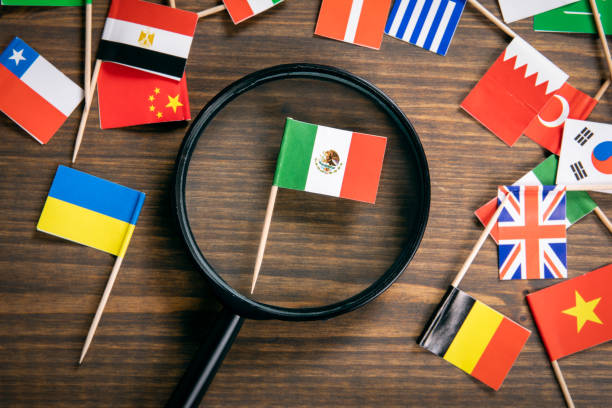 istock Mexican flag. Flags of many countries, magnifying glass on table 1207109802