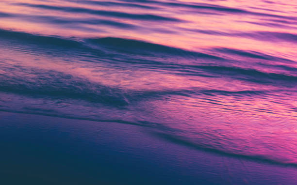 istock Blurred Pink and Purple Waves in Motion Closeup Backgrounds 1207109824