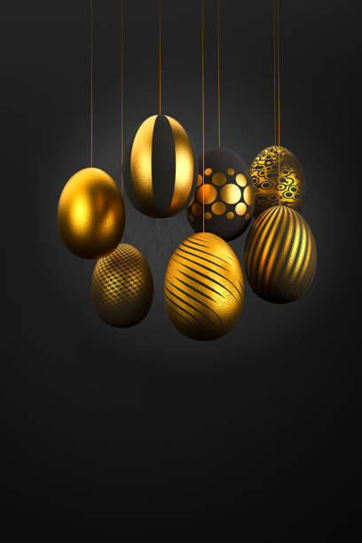 istock Luxury easter Eggs with different patterns in gold hanging on threads in front of a dark textured background. 1207111295