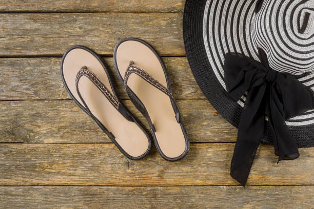 istock Summer holiday with accessories on flip flops and hat relaxing wood background View from flat lay 1207112670