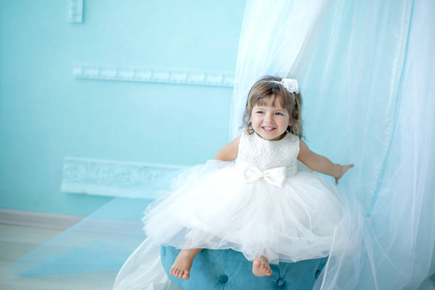 little girl 3-4 years old dressed in baby fluffy beautiful dress in beautiful interior - child caucasian little girls 3 4 years imagens e fotografias de stock
