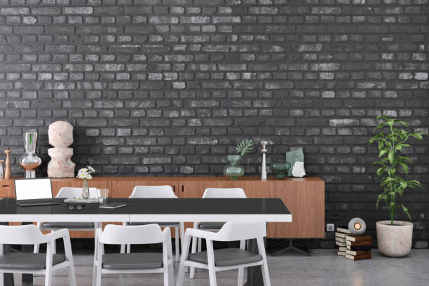 istock Office space with conference desk and blank wall 1207114131