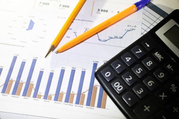 istock Financial accounting stock market graphs analysis, calculator 1207118834