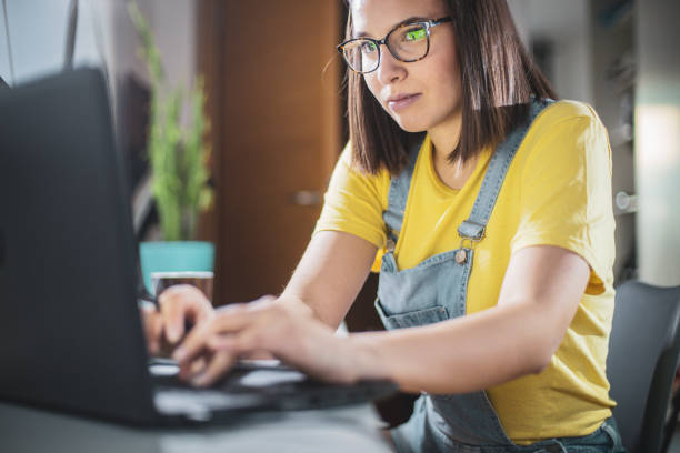 istock Young woman studying at home 1207119028