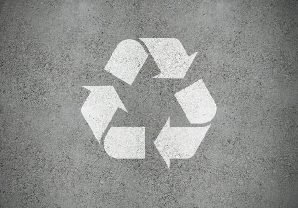 istock White recycling symbol on concrete surface, as road marking 1207126917