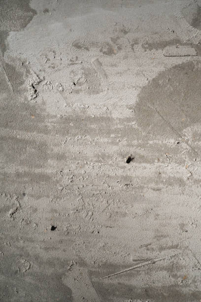 istock Dark grey grungy concrete texture, wall with concrete plaster, renovation background concept 1207126964
