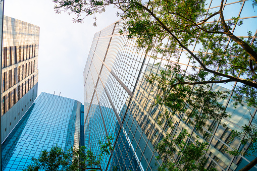 Modern Hong Kong buildings, glass facades reflecting sky