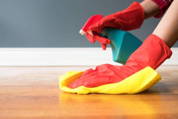 istock Cleaning parquet with yellow cloth 1207138902