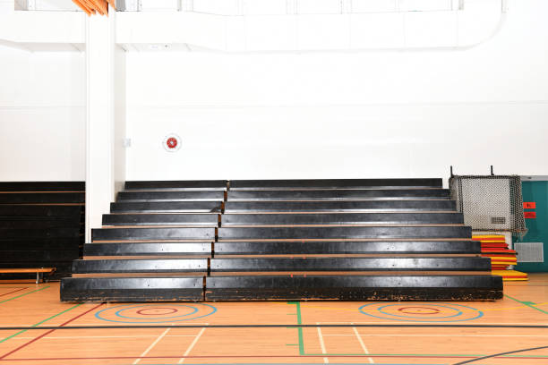 Gymnasium Bleachers Empty Bleachers in a School Gym bleachers stock pictures, royalty-free photos & images