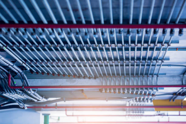 blurry picture of electrical conduit and cabling. blurry image for construction background. - electrical junction box imagens e fotografias de stock