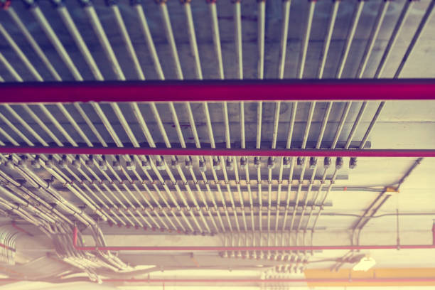 Blurry picture of electrical conduit and cabling. Blurry image for construction background. The rows of electrical conduit and signal cables in the parking building.