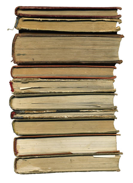 istock Stack of old  aged antique books isolated on white background. 1207143104