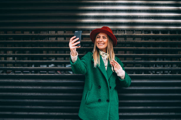 istock Urban Woman Taking Selfie 1207143914