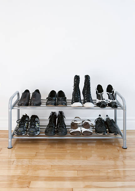 Shoe rack on a wooden floor stock photo