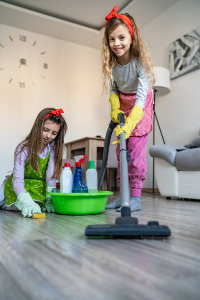 istock Kids clean the house 1207152141