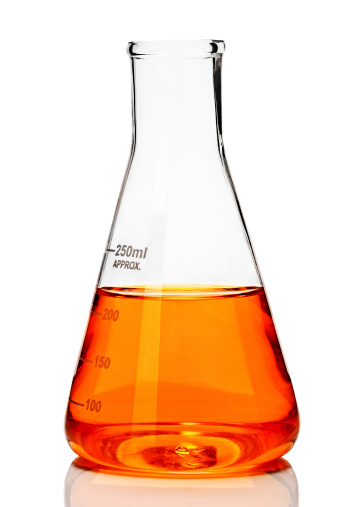 Chemistry conical flask with orange liquid