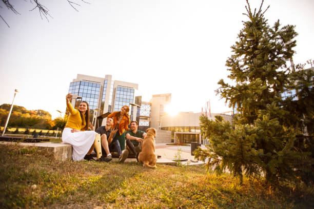 istock Friends relaxing together outdoors and taking a selfie together 1207153037