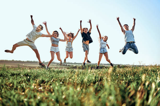 istock Happy young people jumping in mountains. 1207153162