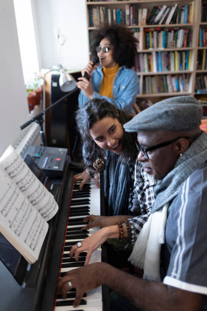 istock Group of musicians making rehearsal in studio 1207153180
