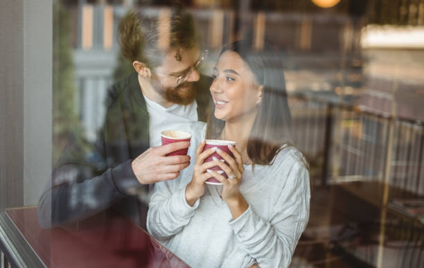 istock Happy couple enjoying coffee during date 1207153445