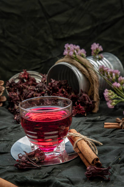 istock Roselle tea (Jamaica sorrel, Rozelle or hibiscus sabdariffa ) with dry roselle and brown cane sugar cube. 1207154015