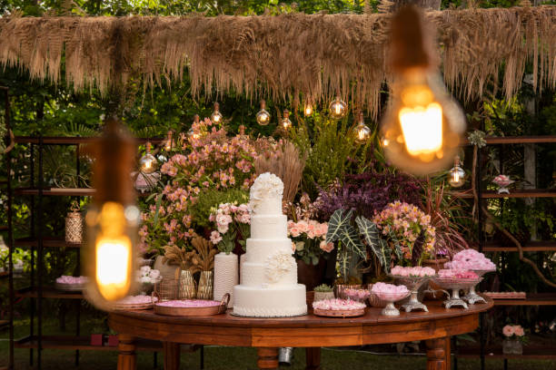 istock Wedding Setup. Cake table with sweet, decoration and flowers 1207156352