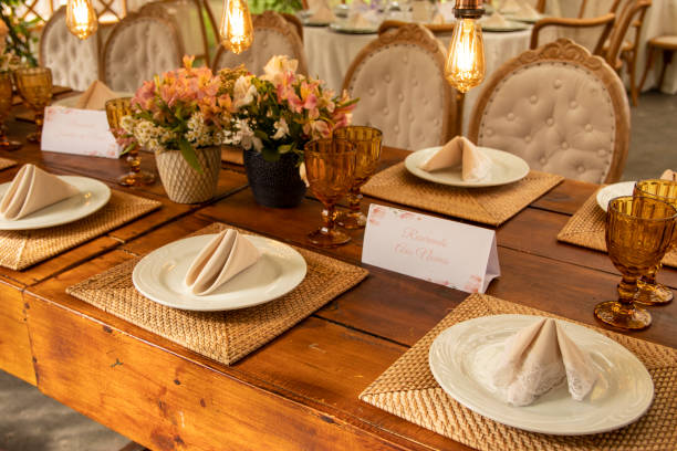 istock Wedding Setup. Banquet with table and chairs. Decoration, flowers, ware, glass 1207156485