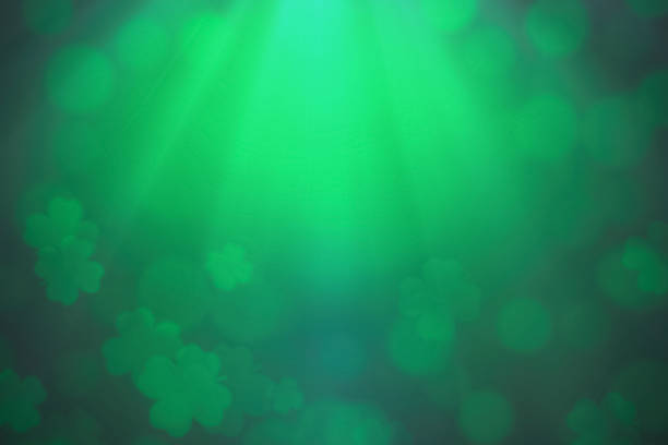 ST Patrick's day background green clover leaf bokeh lights defocused for ST Patrick's day celebration design background.