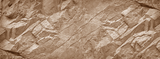 Fondo de pared de piedra. Textura de roca marrón claro. Telón de fondo grunge de piedra. photo
