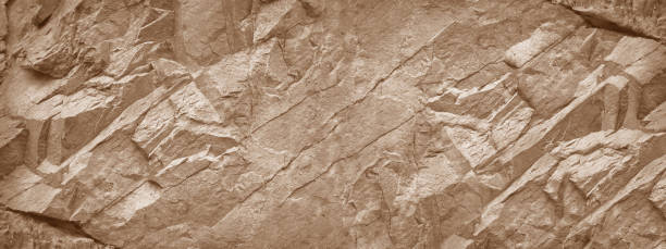 石壁の背景。明るい茶色の岩の質感。ストーングランジの背景。 - 岩 ストックフォトと画像